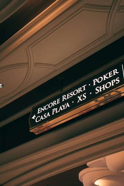 Directional sign for encore resort, casa playa, poker, and shops.